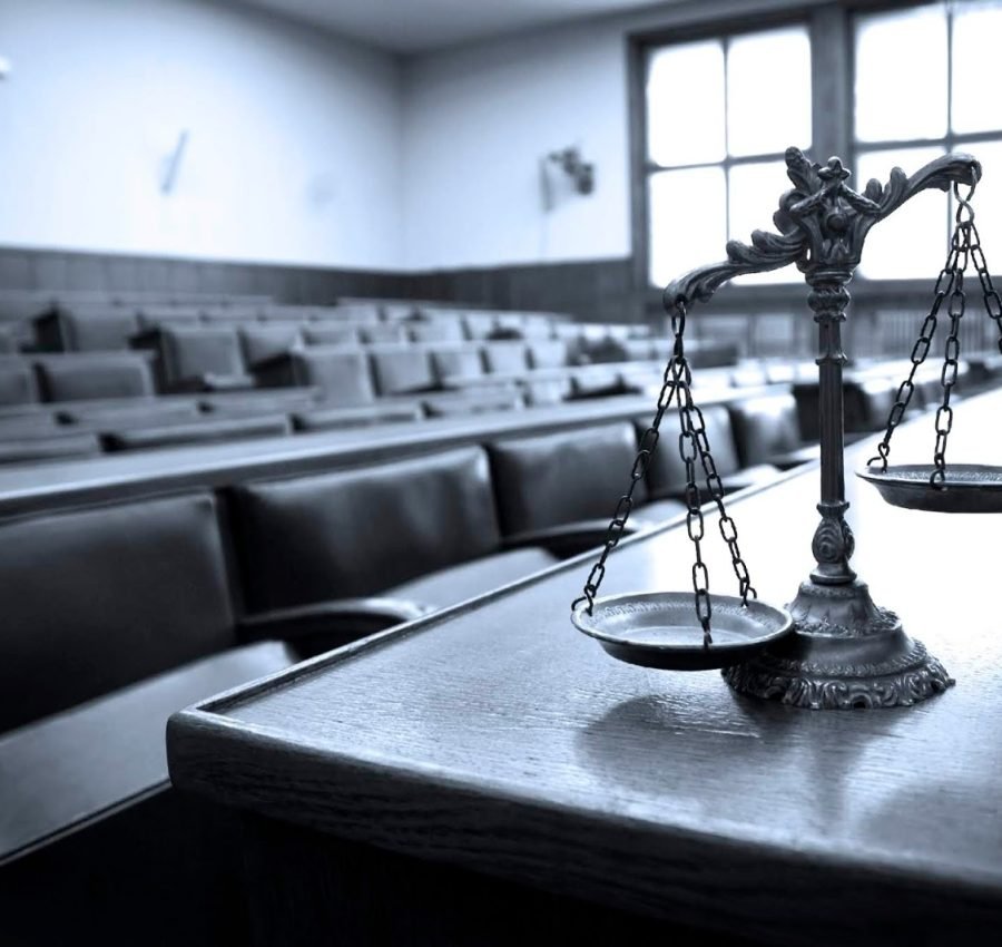 Symbol of law and justice in the empty courtroom, law and justice concept, blue tone
